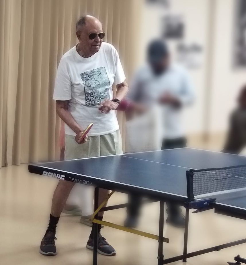 seniors enjoying table tennis at senior citizen homes to keep themself fit and healthy
