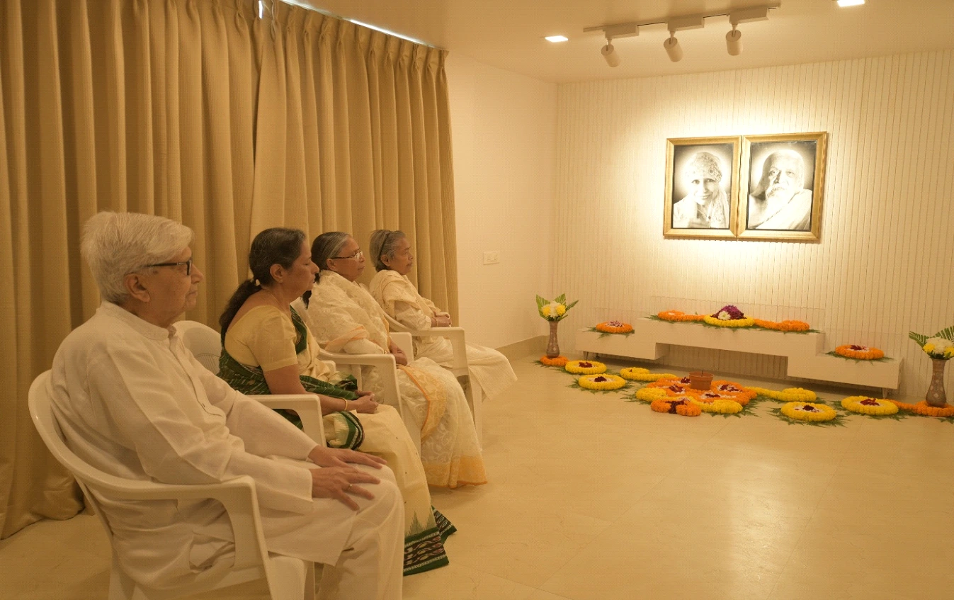 Elderly residents sitting together during spiritual and volunteer activities at Aumorto retirement living community