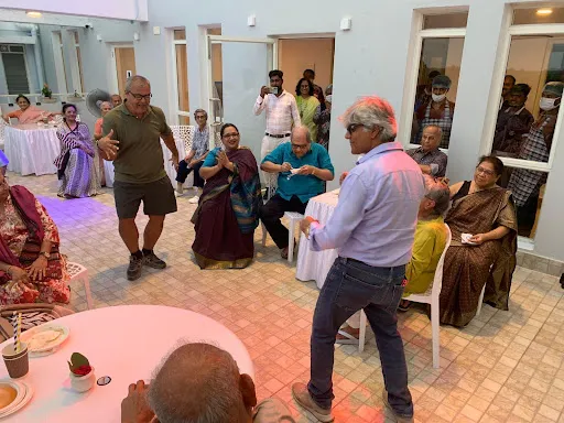 Residents celebrating cultural festivals and music sessions at Aumorto retirement home in Kolkata, enjoying vibrant senior living.