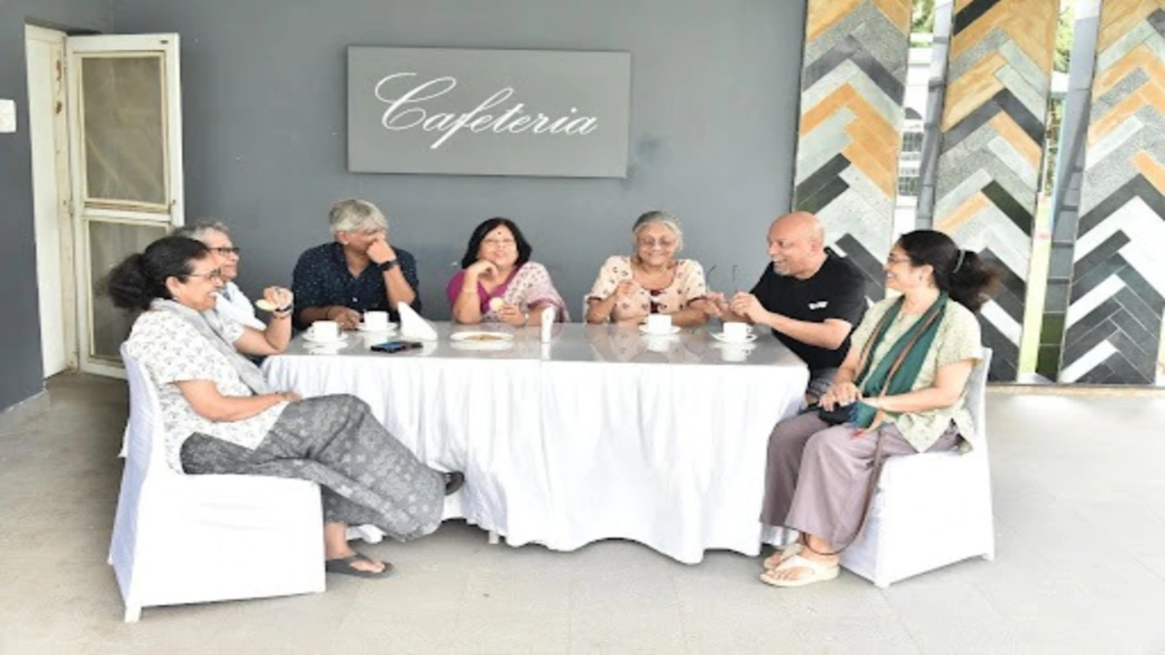Senior people sitting together and smiling at a retirement community in Kolkata